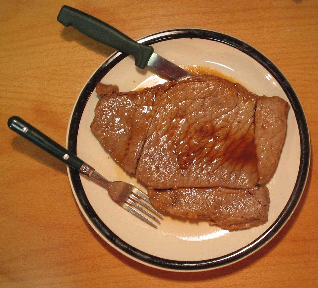 Slices of cooked beef on a plate