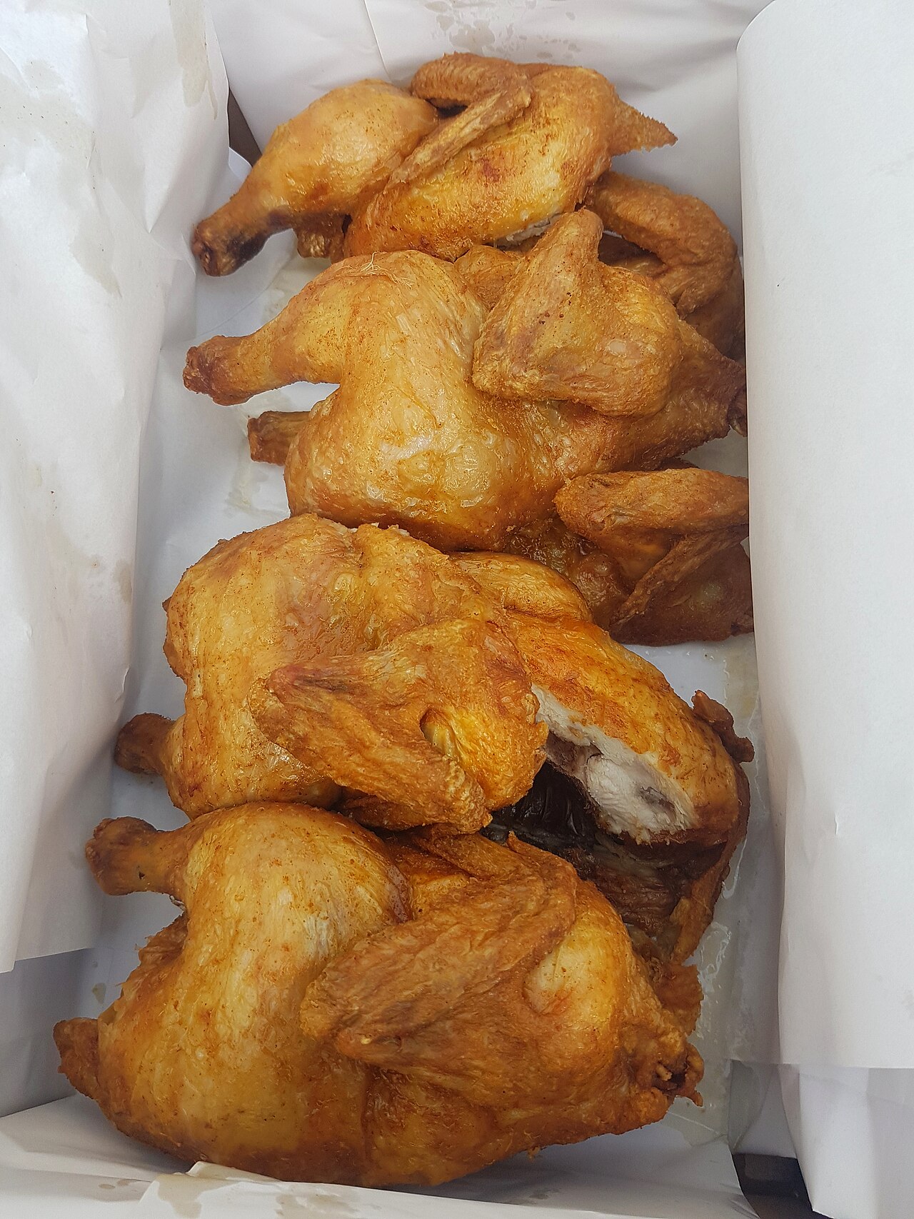 Crispy fried chicken pieces in a box